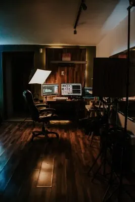 Post-production workstation in a dark editing and content finishing studio